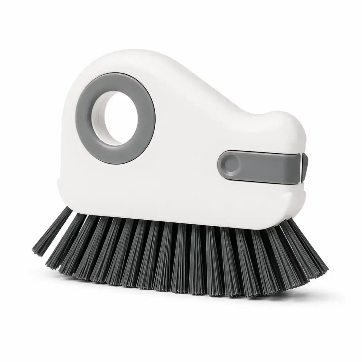 White handheld groove cleaning brush with dense black bristles and an integrated scraper, designed for cleaning window tracks, sliding door rails, tile grout, and narrow household gaps.