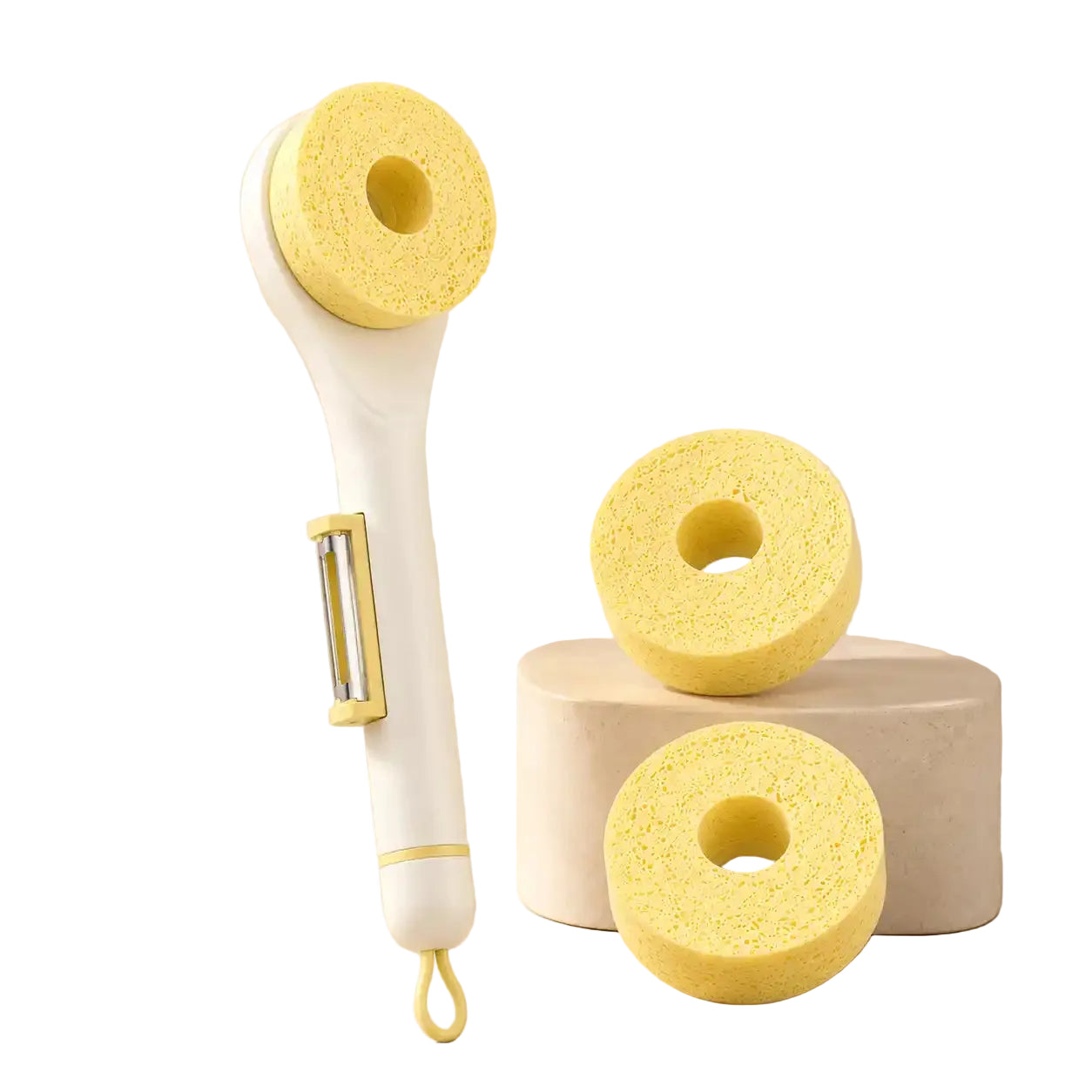 White wood pulp sponge cleaning brush with a built-in vegetable peeler displayed alongside two extra natural wood pulp sponge replacement heads on a warm beige background.