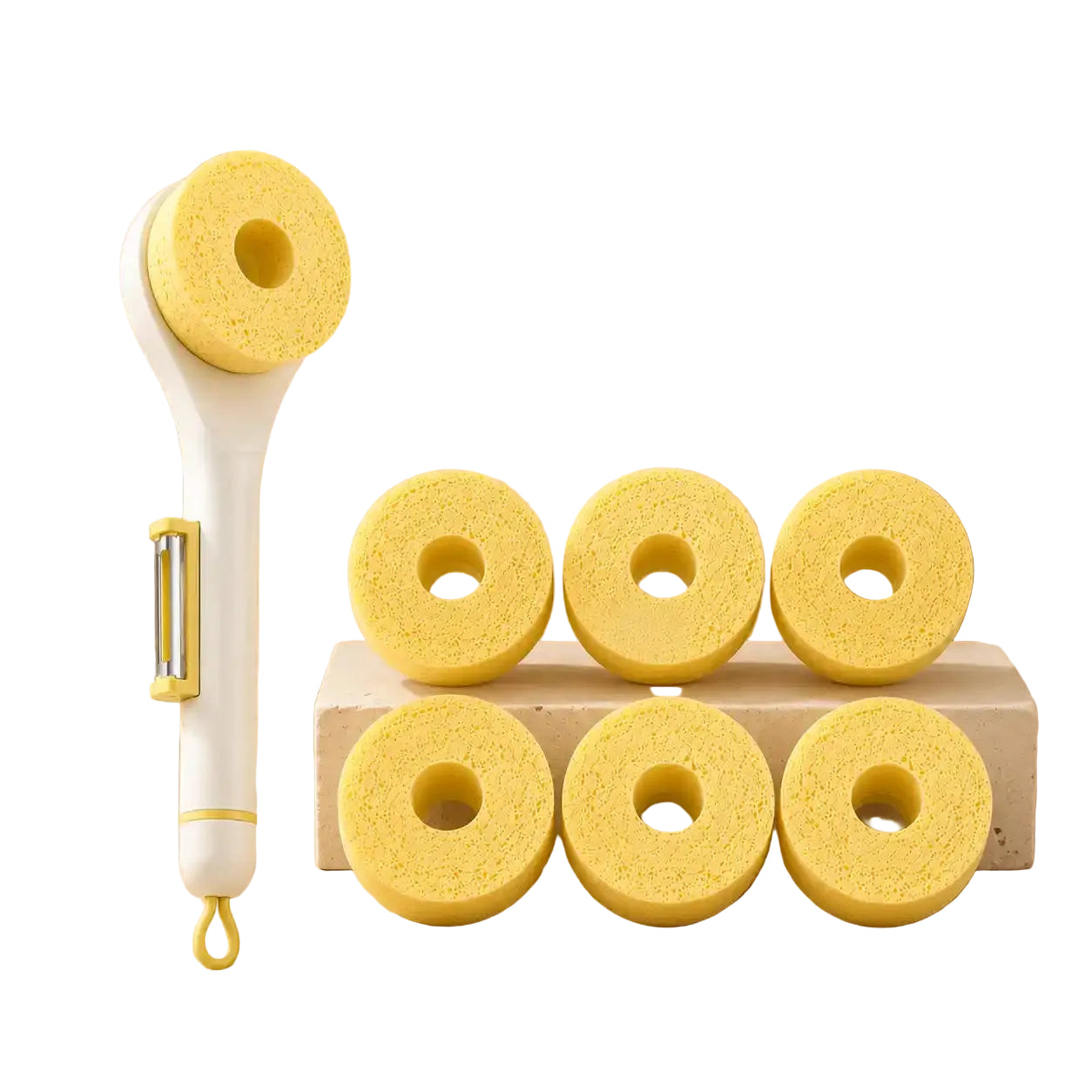 White wood pulp sponge cleaning brush with a built-in stainless steel vegetable peeler displayed alongside six natural wood pulp sponge replacement heads on a warm beige background.